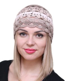 a woman with blonde hair wearing a knitted headband on her head and looking at the camera