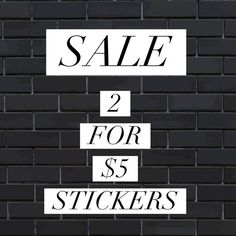 a brick wall with the words sale 2 for $ 5 stickers written on it