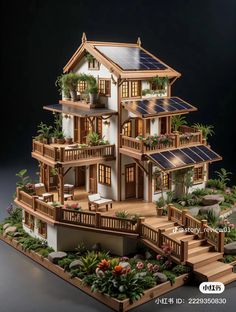 a model of a house with lots of windows and plants on the balconies