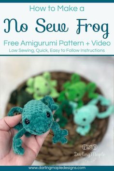 a hand holding a small stuffed animal in front of a basket filled with green and blue toys