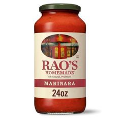 raq's marinara sauce in a jar with the lid open on a white background