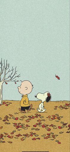 charlie brown and his dog are sitting on the ground in front of a tree with leaves