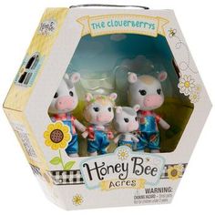 three little toy animals are in a box