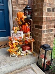 a welcome sign and pumpkins on the front porch