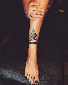 a woman's foot with a tattoo on it