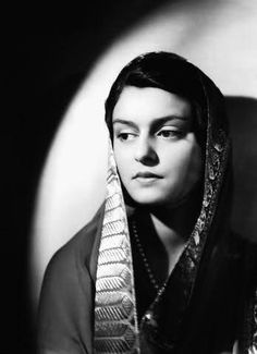 black and white photograph of a woman wearing a shawl