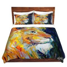 a bed with an animal painting on it