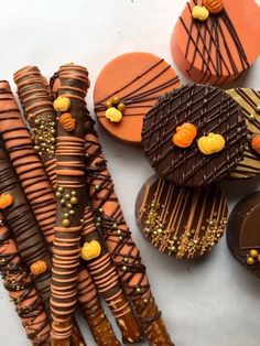 decorated cookies and candy sticks on a table