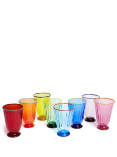 a group of colorful glasses sitting next to each other