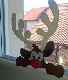 a window sill with a reindeer head on it