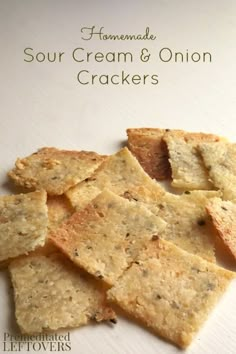 homemade sour cream and onion crackers on a white plate with text overlay that reads homemade sour cream and onion crackers