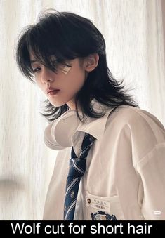 Wolf cut is a tapered haircut with a choppy short layers that start at the crown and gradually get longer toward the end. The haircut is defined by its heavy layers and the volume at the crown and looks like a mixture of shag and mullet. Haircut inspired by Mikasa Ackerman #pixiebobhaircut #hairology https://youtu.be/lc9jcog75Nc Black And White Wolfcut, Wolf Cut Hair, Wolf Cut