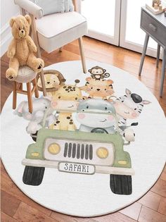 a round rug with animals on it in the middle of a room next to a chair