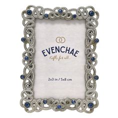 an ornate silver frame with blue stones on the edges and in the middle, reads evenchae gift for all