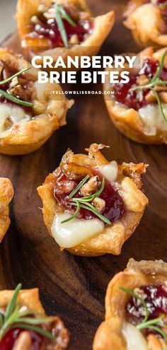 cranberry brie bites on a wooden platter