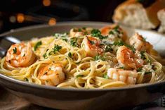 pasta with shrimp and parsley in a bowl