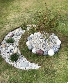 a circle made out of rocks in the grass