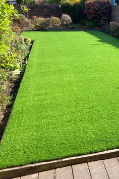 an artificial lawn in the middle of a garden