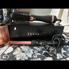 Foxybae Rose Gold Blowout Dryer Brush New & Foxy Bae Curling Wand. Foxy Bae Rose Gold Blow Dryer Brush And Curling Wand Combo New In Box, Never Used. Get Salon Results From Home With Our Rose Gold Blowout Brush. This All-In-1 Dryer Brush Detangles, Dries, And Styles Hair All In One Easy-To-Use Tool! The Ceramic-Coated Barrel Delivers Gorgeous Body And Shine All While Retaining Your Hair's Natural Moisture. Get The Salon Look Without The Price Tag, And Stay Frizz-Free And Foxy! Use Our Full Size Curly Blowout, Blowout Brush, Blow Dryer Brush, Dryer Brush, Blow Dry Brush, Shorter Hair, Curling Wand, Blow Dryer, Frizz Free