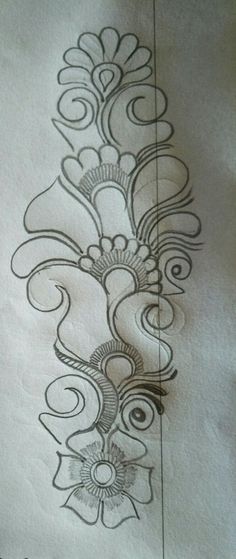 a drawing of flowers and swirls on paper