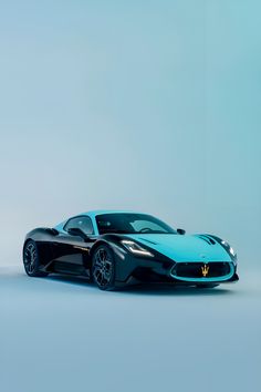 a black and blue sports car on a gray background