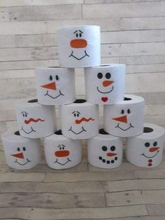 several toilet paper rolls with faces painted on them