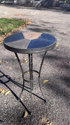 a small table sitting on the side of a road