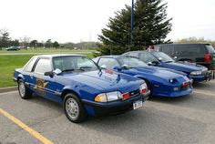 three police cars parked in a parking lot