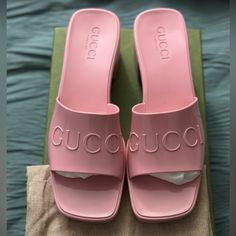 This Is An Authentic Pair Of Gucci Rubber Womens Gucci Logo Slide Sandal Size 38 In Pastel Pink. These Stylish Sandals Are Crafted Of Pink Rubber With The Gucci Logo Embossed On The Front Strap. Designer Id: 624730 Size: 38eu (Us 8) Heel: 2.25 In Platform: 0.75 In Comes With Box 2 Dust Bag Designer Slides With Flat Heel For Summer, Gucci Sandals With Heel Strap, Gucci Summer Sandals With Padded Heel, Gucci Sandals With Heel Strap For Spring, Chic Gucci Heels For Summer, Designer Gucci Heels, Luxury Gucci Heels For Summer, Chic Gucci Sandals For Spring, Designer Open Toe Slides For Spring