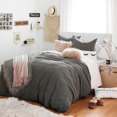 a bed room with a neatly made bed and pillows