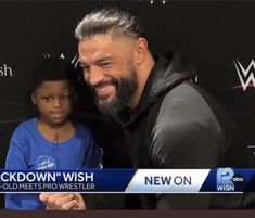 a man standing next to a little boy in front of a black wall with the words, lockdown'wish