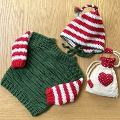 two knitted hats and one crochet bag sitting on a table next to each other