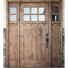 the front door is made from wood and has glass panels