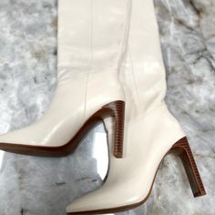 Popular Sold Out White Leather Boots. Brand New, Never Worn. 100% Leather. Tall Leg. Rounded Toe. Rectangular Heel. Inner Lining. 3.94 In Heel. White Pointed Toe Heeled Boots For Work, Chic White Closed Toe Heeled Boots, White Leather Heels For Fall, White Spring Office Boots, White High Heeled Boots With Padded Heel, Chic White Heeled Boots With Padded Heel, White Heeled Boots With Padded Heel, Chic Cream Heeled Boots, Chic Cream High Heeled Boots