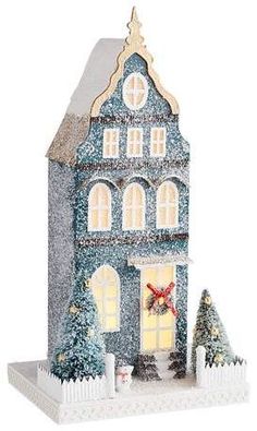 a blue house with christmas decorations on the front