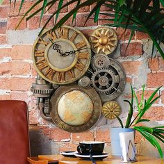 a wall mounted clock sitting on the side of a brick wall next to a table