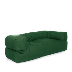 a green couch sitting on top of a white floor