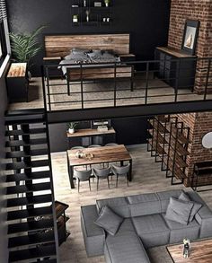 an aerial view of a living room and dining area in a loft style apartment with exposed brick walls