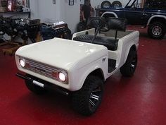 an off - road vehicle is parked in a garage