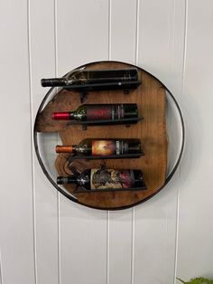 a wine rack with six bottles on it