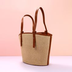 Add a summer-inspired touch to your accessories edit with this straw bucket tote bag. Woven from straw with leather trimmings, this handbag makes us look forward to summer and escapism. It comes with an open top and is roomy enough for all your essentials. Easy-to-wear wardrobe staples that combine classic and contemporary styles.Width (cm): 28 cmHeight (cm): 16 Color: Light brownInterior Material: Polyester CottonMaterial_bag: StrawBagType: Handbag & Shoulder bagBag Length: 28 cm Woven Straw Top Handle Bag For Shopping, Chic Summer Bags Made Of Natural Fiber, Chic Beach Bag With Braided Handles, Double Handle Straw Shopping Bag, Natural Shoulder Bag With Bamboo Handle For Shopping, Chic Straw Bag With Bamboo Handle For Everyday, Top Handle Straw Shopping Bag, Chic Daily Use Straw Bag With Bamboo Handle, Straw Top Handle Shopping Bag