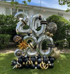 a large number balloon sculpture in the grass