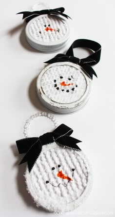 two snowmen made out of crochet sitting next to each other