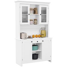 a white kitchen hutch with glass doors and shelves