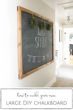 a chalkboard with the words hello spring written on it in front of a hallway