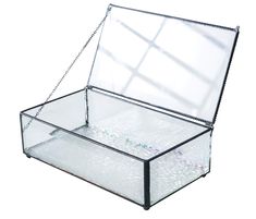 an empty glass box with chains hanging from the bottom and inside, on a white background