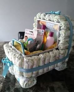 a baby's diaper basket with items in it