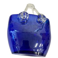 a blue handbag with two clear handles on the front and back sides, hanging from a hook