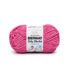 bernat baby blanket yarn in pink, on a white background with the words bernat written