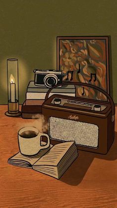 there is a radio, book and cup on the table